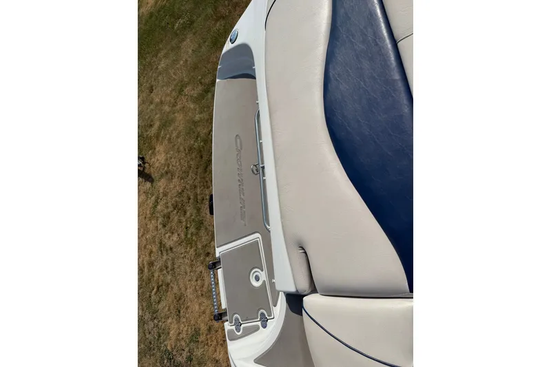 Slide: The Image of 2013 Crownline 21 SS boat interior with beige and blue seating. - 20