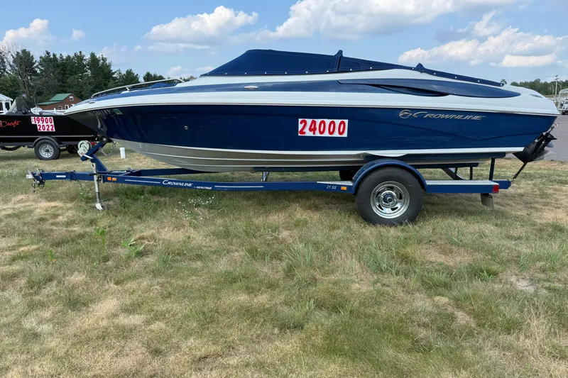 The Image of 2013 Crownline 21 SS boat on trailer, blue and white, priced at 24000. - 1