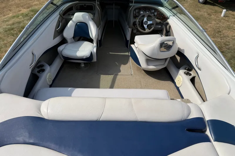 Slide: The Image of Interior of 2013 Crownline 21 SS boat with white and blue seating. - 25