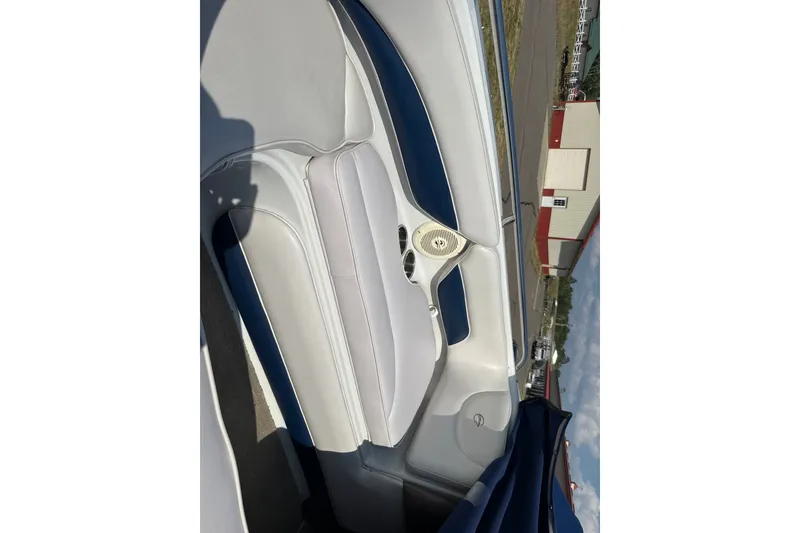 Slide: The Image of Interior of 2013 Crownline 21 SS boat with white and blue seating. - 12