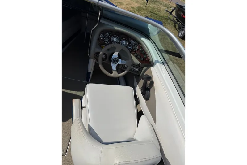Slide: The Image of Interior view of 2013 Crownline 21 SS boat cockpit with steering wheel and gauges. - 23