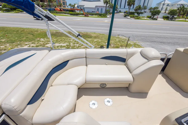 Slide: The Image of 2014 Aqua Patio 22 SLC boat interior with beige seating and blue accents. - 31