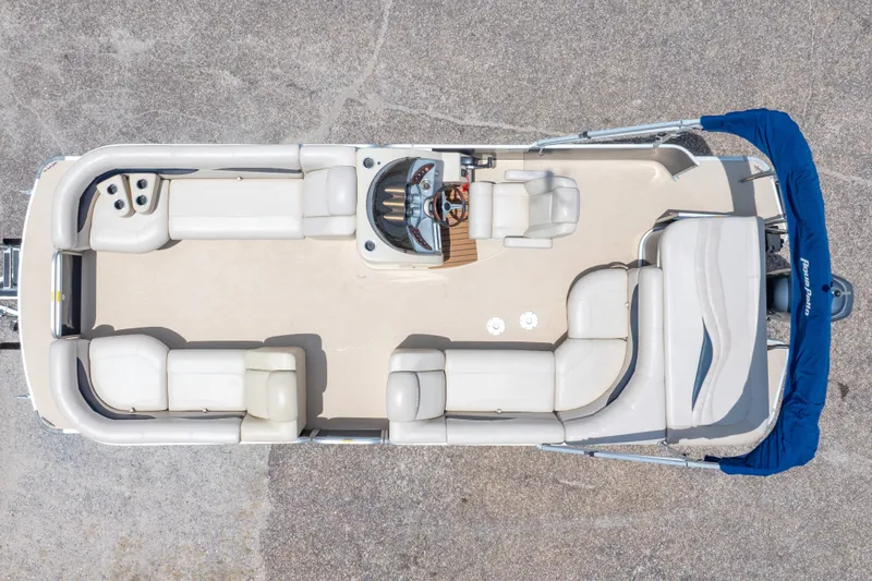 Slide: The Image of Aerial view of 2014 Aqua Patio 22 SLC pontoon boat with spacious seating and blue canopy. - 6