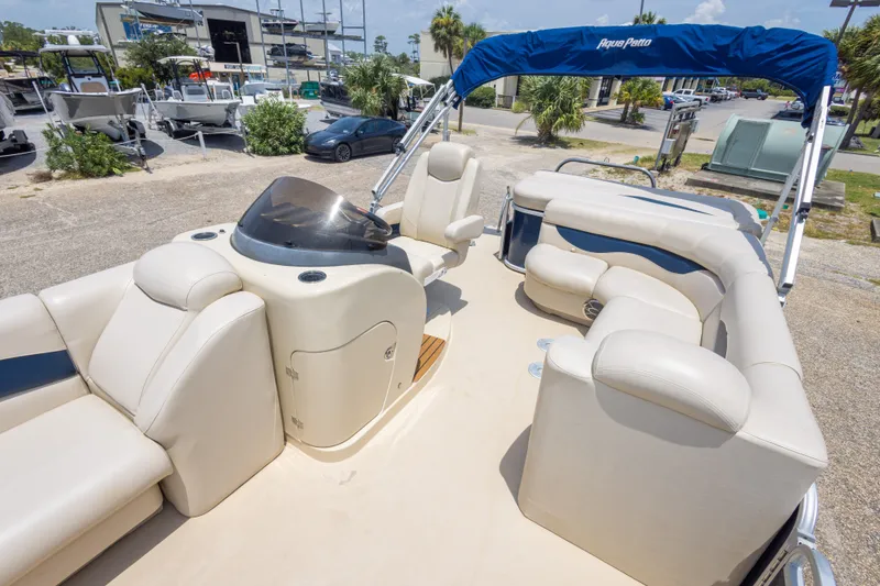Slide: The Image of 2014 Aqua Patio 22 SLC pontoon boat with beige seating and blue canopy. - 28