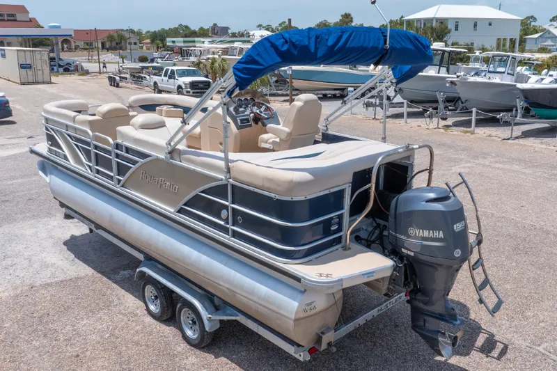 Slide: The Image of 2014 Aqua Patio 22 SLC pontoon boat with Yamaha motor on trailer in marina. - 38