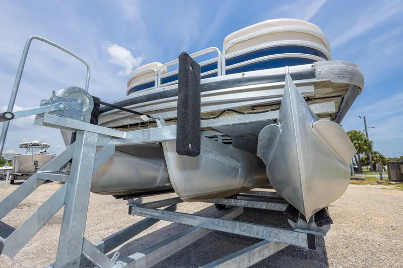 Slide: The Image of 2014 Aqua Patio 22 SLC pontoon boat on trailer under clear blue sky. - 17