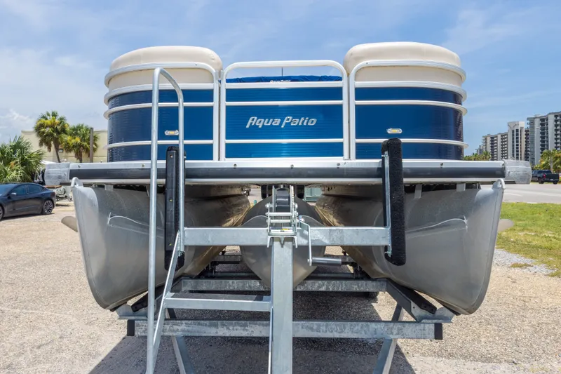 Slide: The Image of 2014 Aqua Patio 22 SLC pontoon boat on trailer, parked outdoors under clear sky. - 16