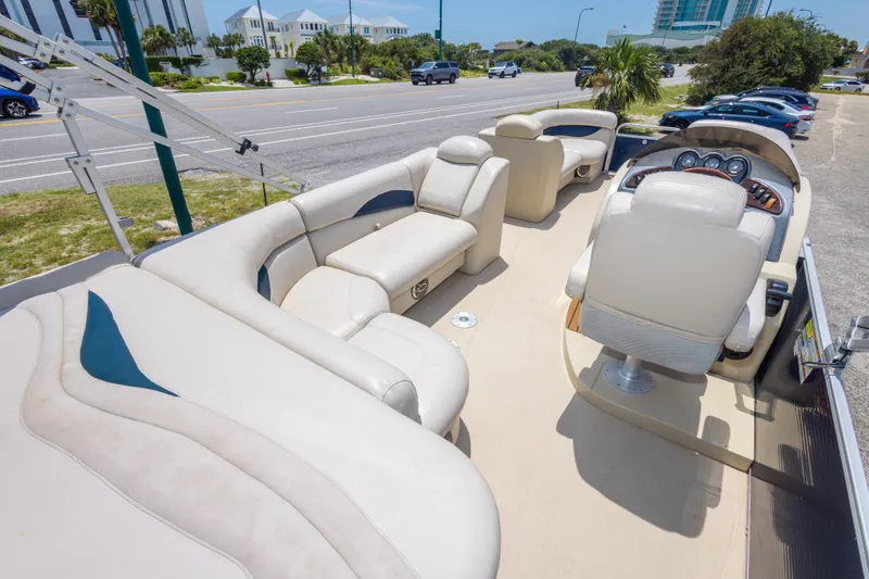 Slide: The Image of 2014 Aqua Patio 22 SLC pontoon boat with beige seating and modern dashboard. - 18