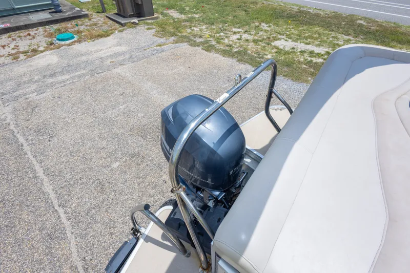 Slide: The Image of 2014 Aqua Patio 22 SLC boat with outboard motor and seating area. - 32