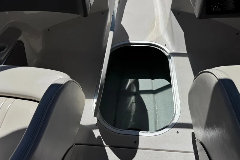 Slide: The Image of 2001 Four Winns 180 Horizon boat interior with open storage compartment. - 17