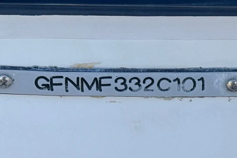 Slide: The Image of Hull identification number on a 2001 Four Winns 180 Horizon boat. - 26