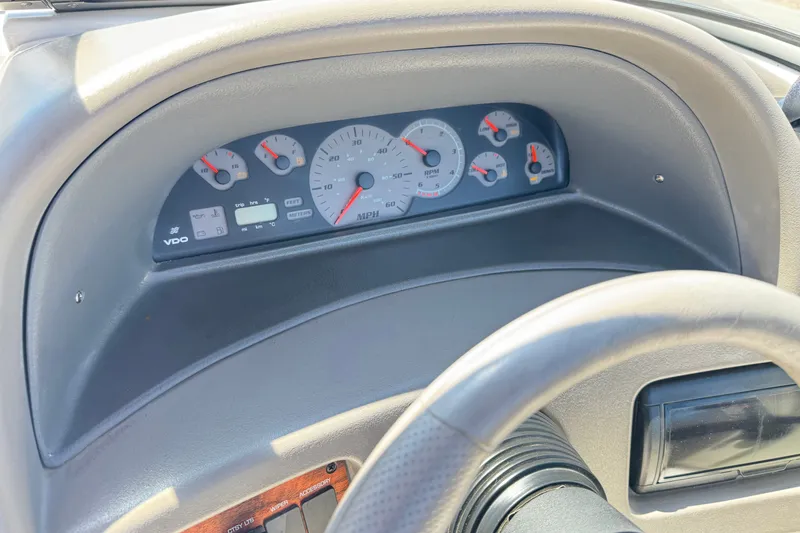 Slide: The Image of Dashboard of a 2001 Four Winns 180 Horizon boat, featuring speedometer and gauges. - 20