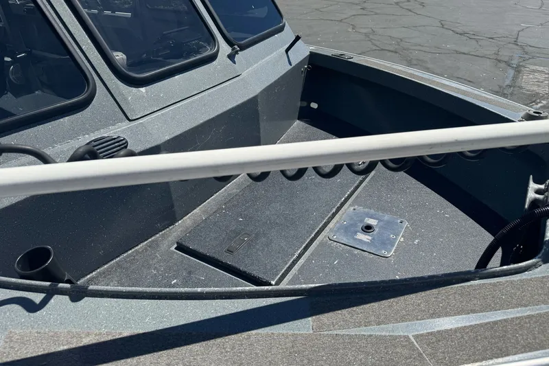 Slide: The Image of 2000 North River 18 Mariner boat interior with windshield and deck details. - 5