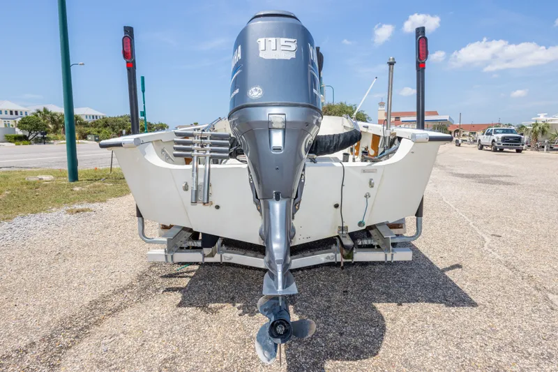 Slide: The Image of 1986 Boston Whaler 18 Outrage boat with Yamaha 115 outboard motor on trailer. - 12