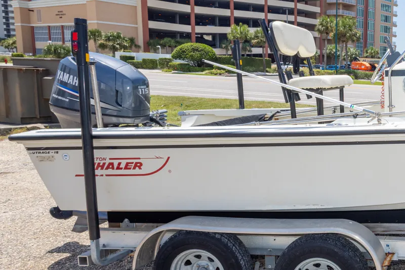 Slide: The Image of 1986 Boston Whaler 18 Outrage boat on trailer with Yamaha 115 engine. - 34