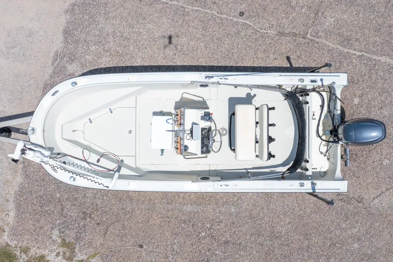 Slide: The Image of Top view of a 1986 Boston Whaler 18 Outrage boat on a concrete surface. - 6