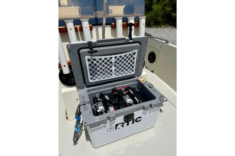 Slide: The Image of Open RTIC cooler with batteries inside on a 1986 Boston Whaler 18 Outrage boat. - 12