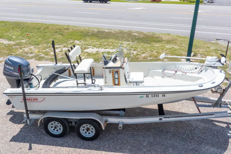 Slide: The Image of 1986 Boston Whaler 18 Outrage boat on trailer with Yamaha outboard motor. - 2