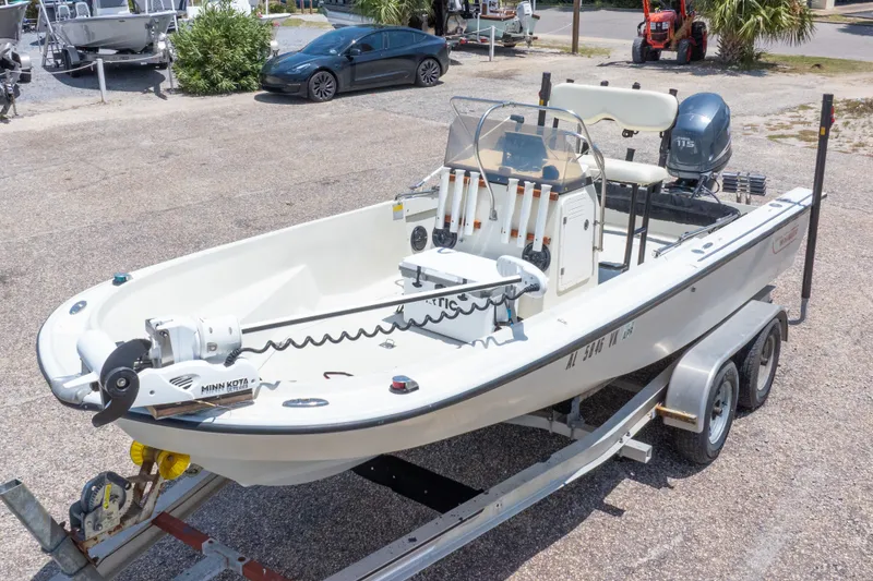 Slide: The Image of 1986 Boston Whaler 18 Outrage boat on trailer, equipped with Minn Kota trolling motor. - 4