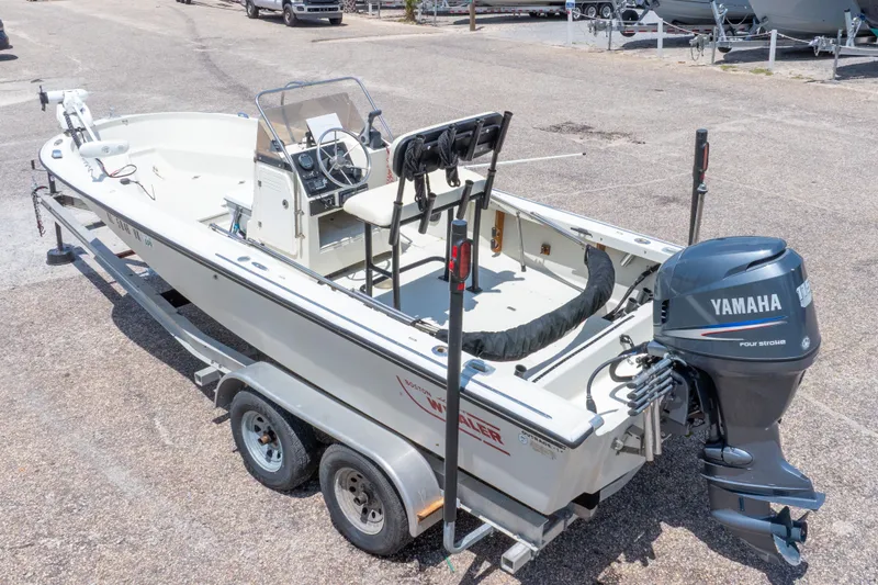 Slide: The Image of 1986 Boston Whaler 18 Outrage boat with Yamaha outboard motor on trailer. - 39