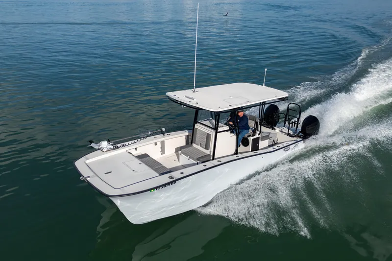 Slide: The Image of 2026 Calcutta 263 boat cruising on calm water, showcasing sleek design and performance. - 1