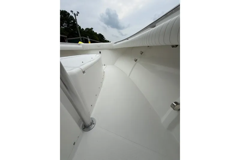 Slide: The Image of 2006 Southport 26 Center Console boat interior with white seating and sleek design. - 30