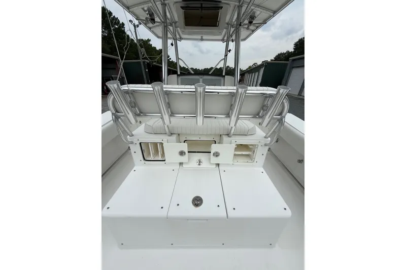 Slide: The Image of 2006 Southport 26 Center Console boat interior with rod holders and storage compartments. - 12