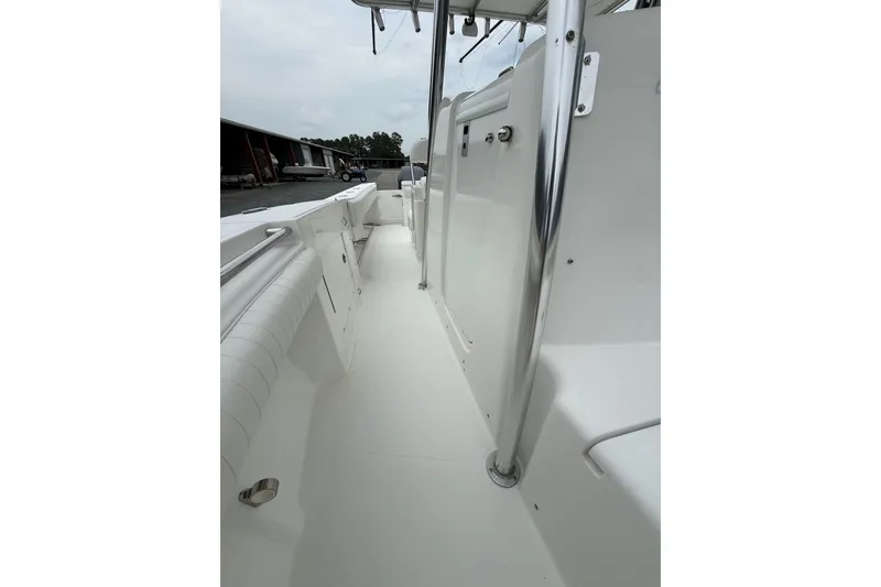 Slide: The Image of 2006 Southport 26 Center Console boat interior with sleek white deck and stainless steel fittings. - 26