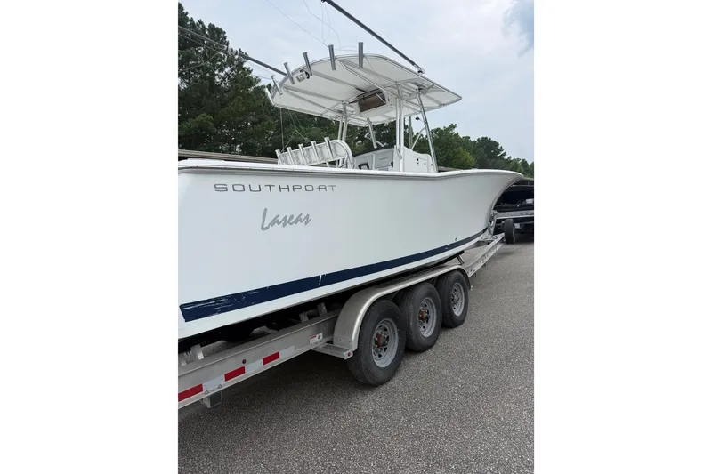Slide: The Image of 2006 Southport 26 Center Console boat on trailer, side view. - 7