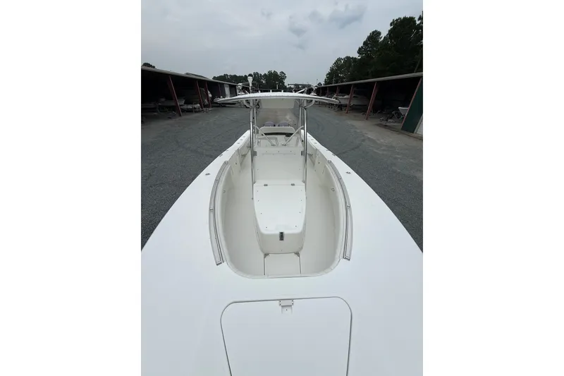 Slide: The Image of 2006 Southport 26 Center Console boat in storage, showcasing spacious deck and sleek design. - 33
