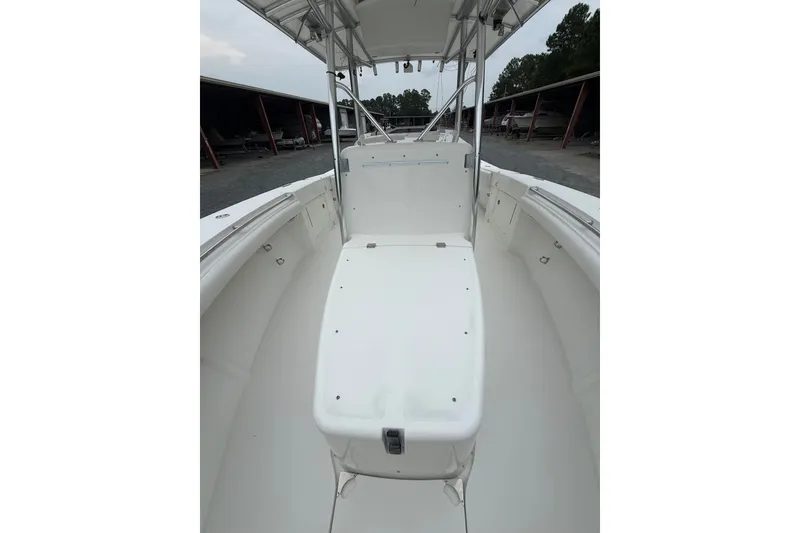 Slide: The Image of 2006 Southport 26 Center Console boat interior with seating and storage. - 24