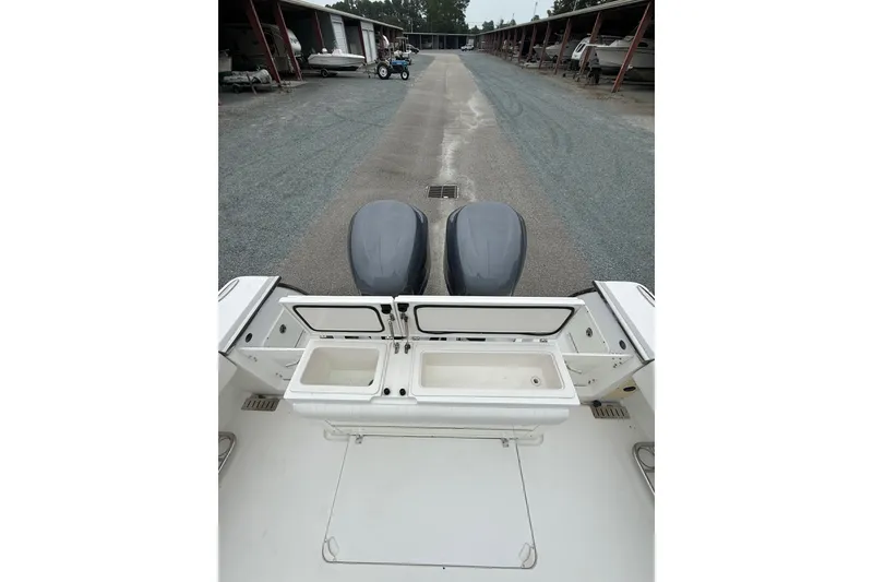 Slide: The Image of 2006 Southport 26 Center Console boat with dual engines in storage facility. - 13