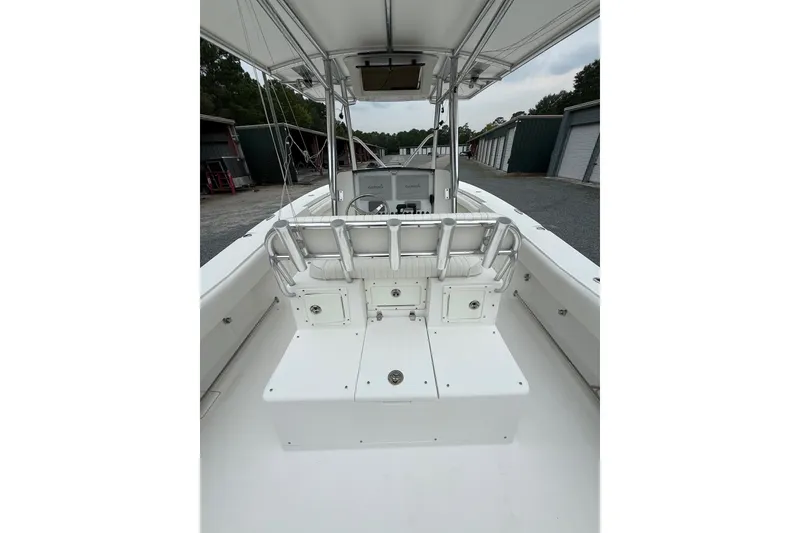 Slide: The Image of 2006 Southport 26 Center Console boat interior with seating and storage compartments. - 11