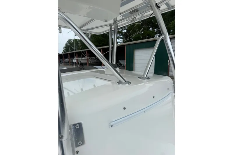 Slide: The Image of 2006 Southport 26 Center Console boat with stainless steel railings and white finish. - 27