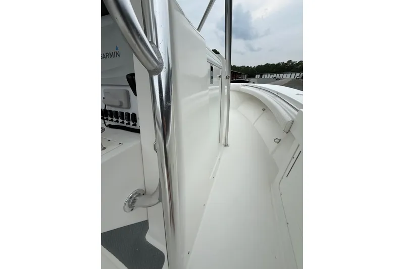Slide: The Image of 2006 Southport 26 Center Console boat deck with stainless steel railings and Garmin equipment. - 29