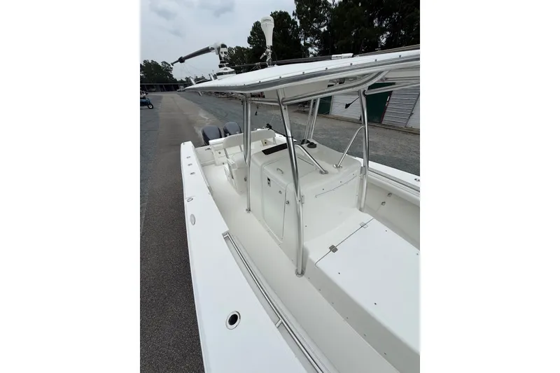 Slide: The Image of 2006 Southport 26 Center Console boat with sleek white deck and sturdy railings. - 35
