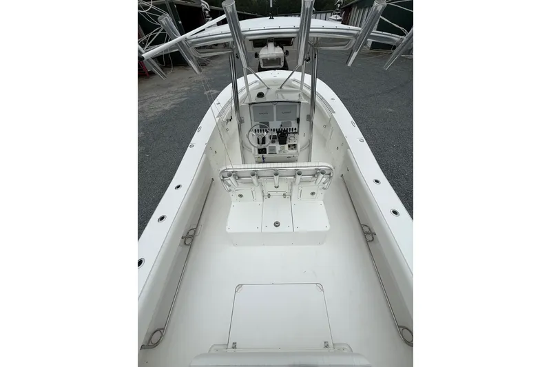 Slide: The Image of 2006 Southport 26 Center Console boat interior with steering console and seating. - 8