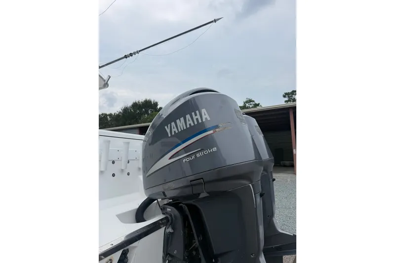 Slide: The Image of Yamaha outboard motor on 2006 Southport 26 Center Console boat, outdoor setting. - 6