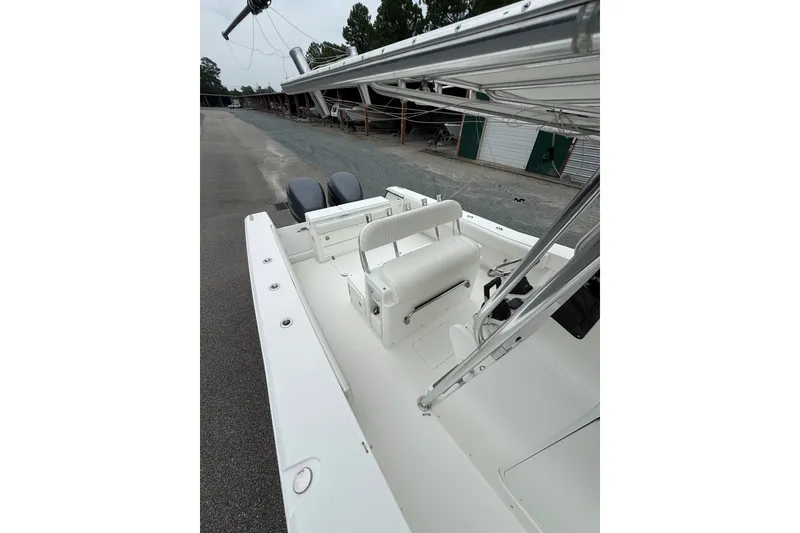 Slide: The Image of 2006 Southport 26 Center Console boat with dual engines and spacious seating area. - 36