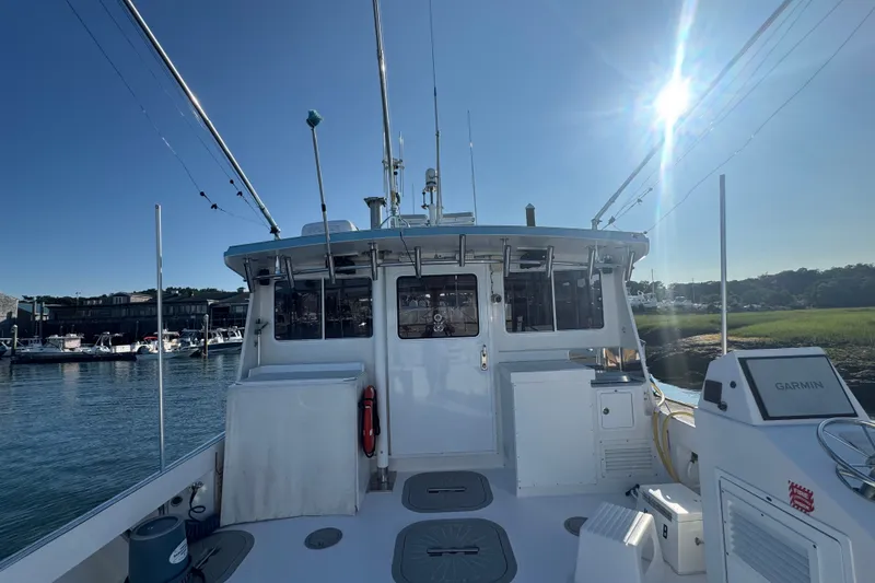 Slide: The Image of 2016 Young Brothers Downeast boat docked under clear blue sky. - 6