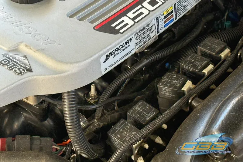 Slide: The Image of Engine compartment of a 2011 Sea Ray 260 Sundeck with Mercury 350 engine components. - 23
