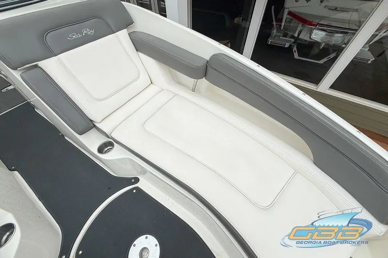 Slide: The Image of 2011 Sea Ray 260 Sundeck interior with white and gray seating, showcasing luxury design. - 6