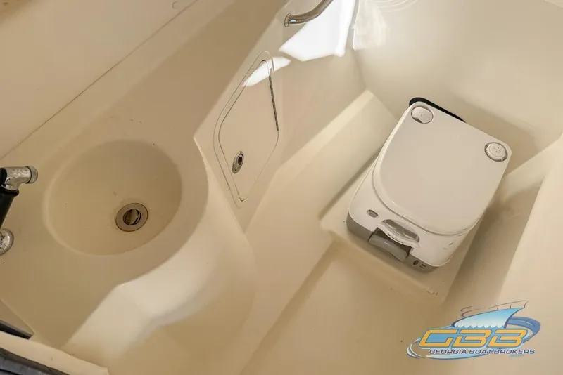 Slide: The Image of Interior of 2011 Sea Ray 260 Sundeck with sink and portable toilet. - 19