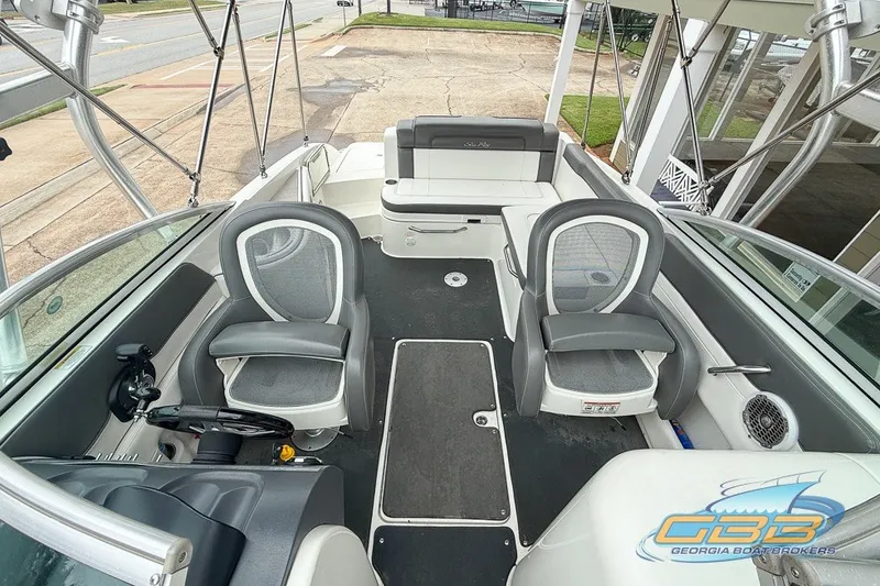 Slide: The Image of 2011 Sea Ray 260 Sundeck interior with seating and steering wheel, showcased by Georgia Boat Brokers. - 4
