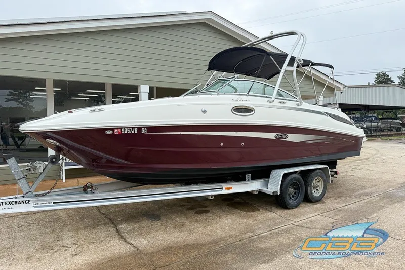 Slide: The Image of 2011 Sea Ray 260 Sundeck boat on trailer, displayed outdoors at Georgia Boat Brokers. - 15