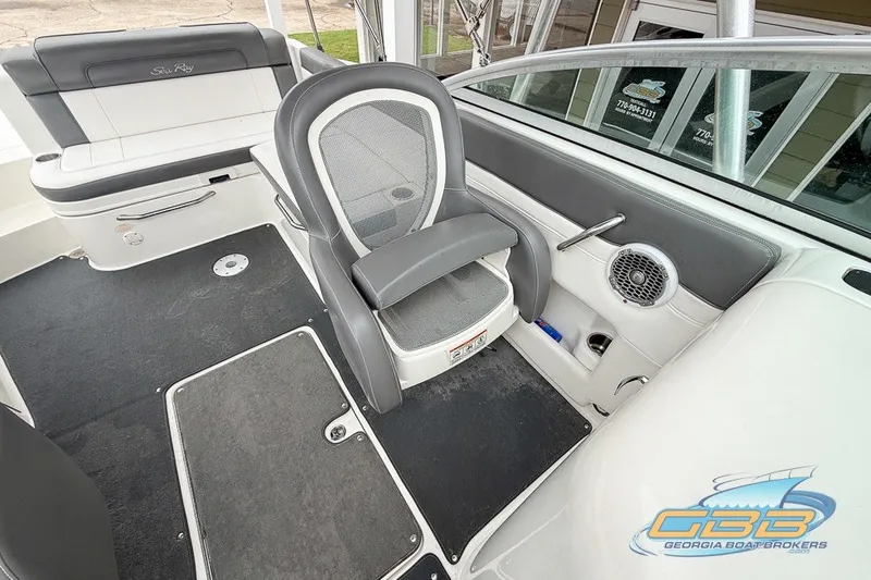 Slide: The Image of Interior of a 2011 Sea Ray 260 Sundeck boat, featuring seating and speaker system. - 10