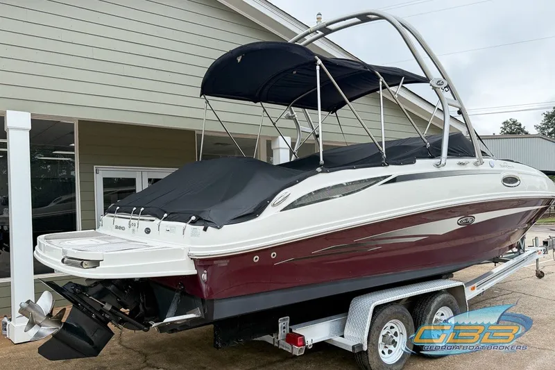 Slide: The Image of 2011 Sea Ray 260 Sundeck boat on trailer, covered and ready for transport. - 25