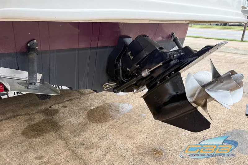Slide: The Image of 2011 Sea Ray 260 Sundeck boat stern with propeller and trim tabs visible. - 21