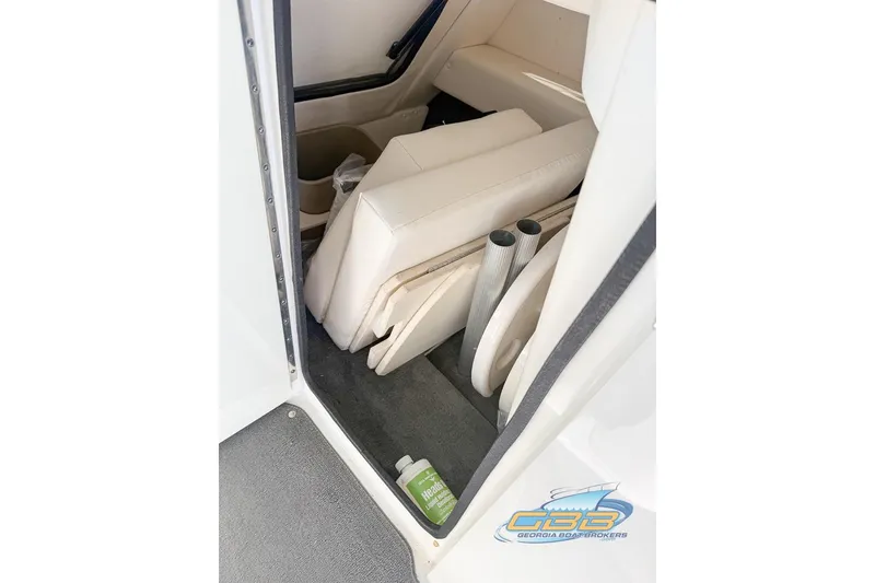 Slide: The Image of Interior storage area of 2011 Sea Ray 260 Sundeck boat with seating and accessories. - 18