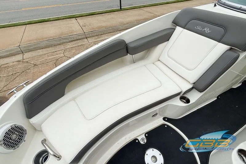 Slide: The Image of 2011 Sea Ray 260 Sundeck boat interior with white and gray seating. - 16